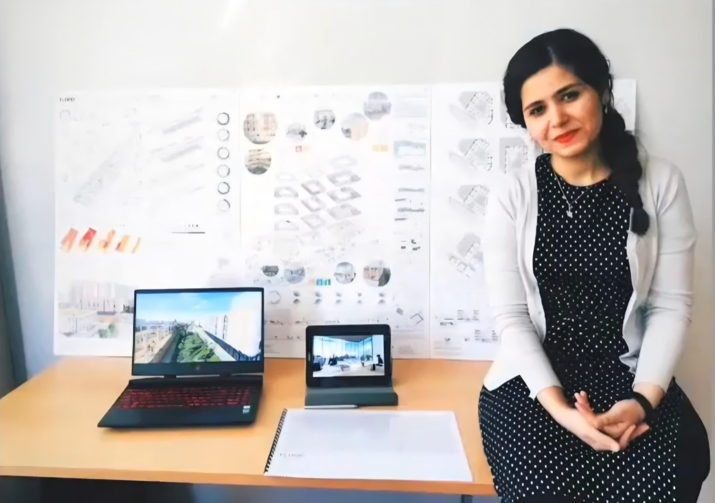 Mina in the architecture studio with her project boards